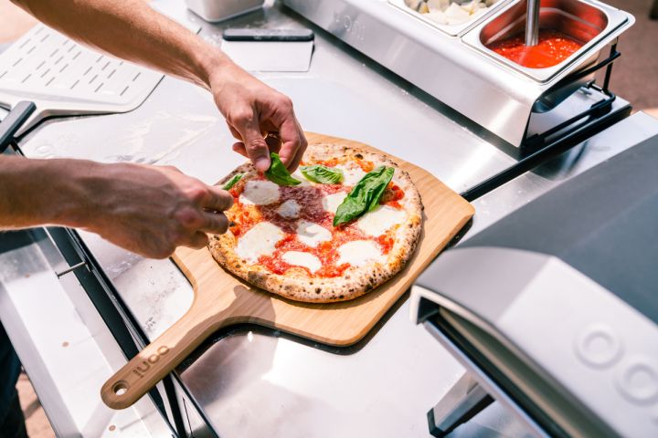 1759907345-lifestyle-ooni-bamboo-peel-and-serving-board.jpg